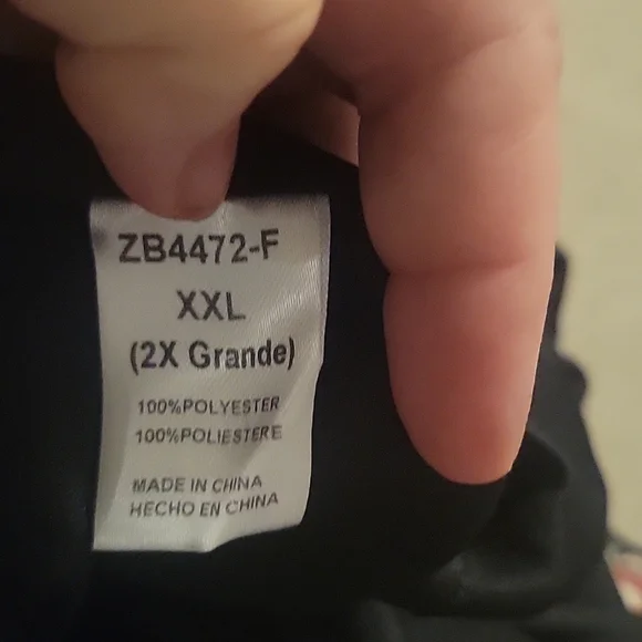 Sleeveless dress, V slit neck, black with floral print.  Lined skirt. - Picture 7 of 9